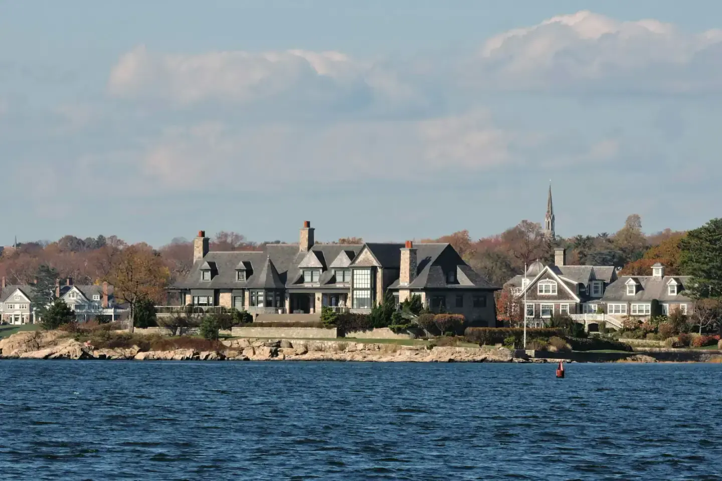 Waterfront homes along the shoreline seen from Tod's Point in Greenwich, Connecticut