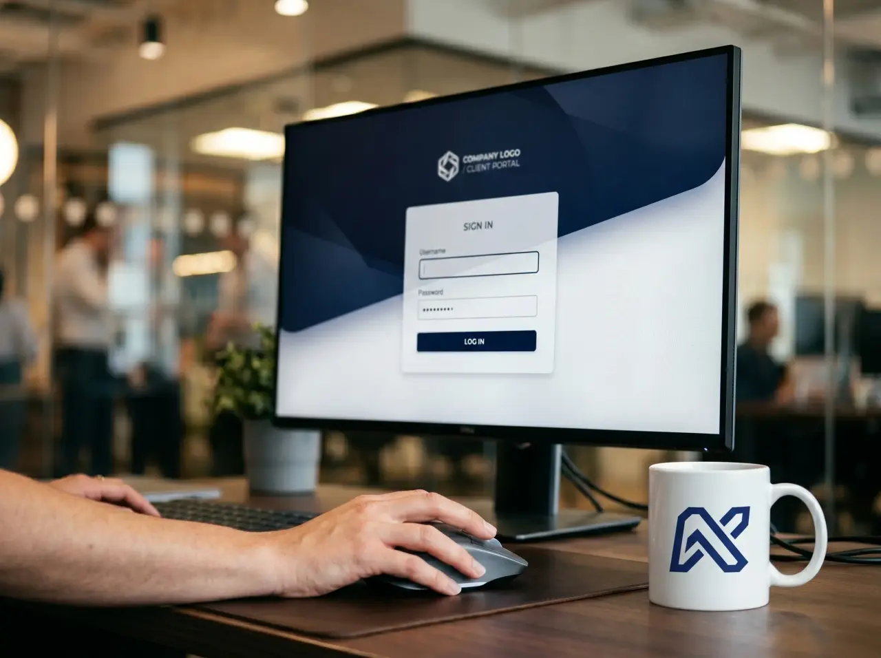 Client portal sign-in screen on a desktop monitor next to a coffee mug