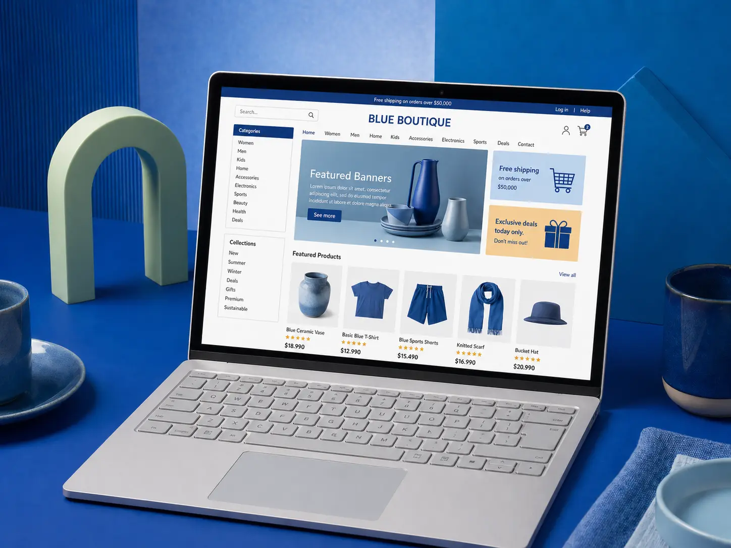 Laptop on a blue desk displaying a clothing and homeware online store with featured products